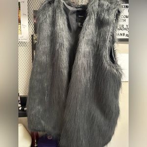 Mid length gray faux fur vest for womens , size large. Used once